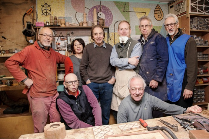 Photo of a group of Shed members in the workshop